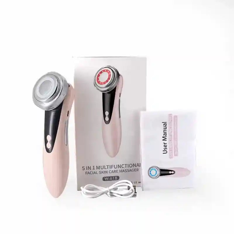 Pink and black EMS facial massager with round head, charging cable, user manual, and product box.