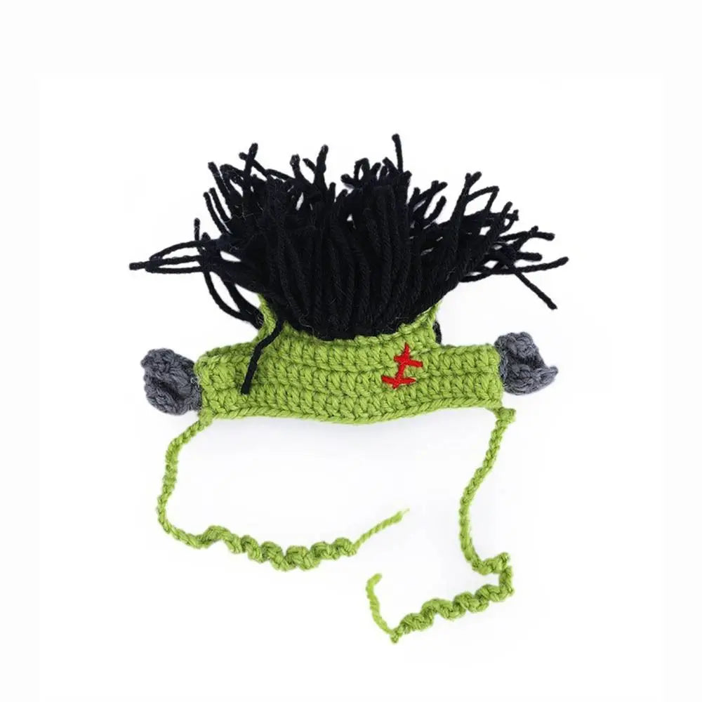 Funny green knitted Frankenstein cat hat with black hair for cute pet cosplay and adjustable Halloween costume fun.
