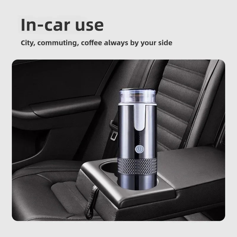 Portable black metal electric coffee maker in a car cup holder for travel and commuting convenience.