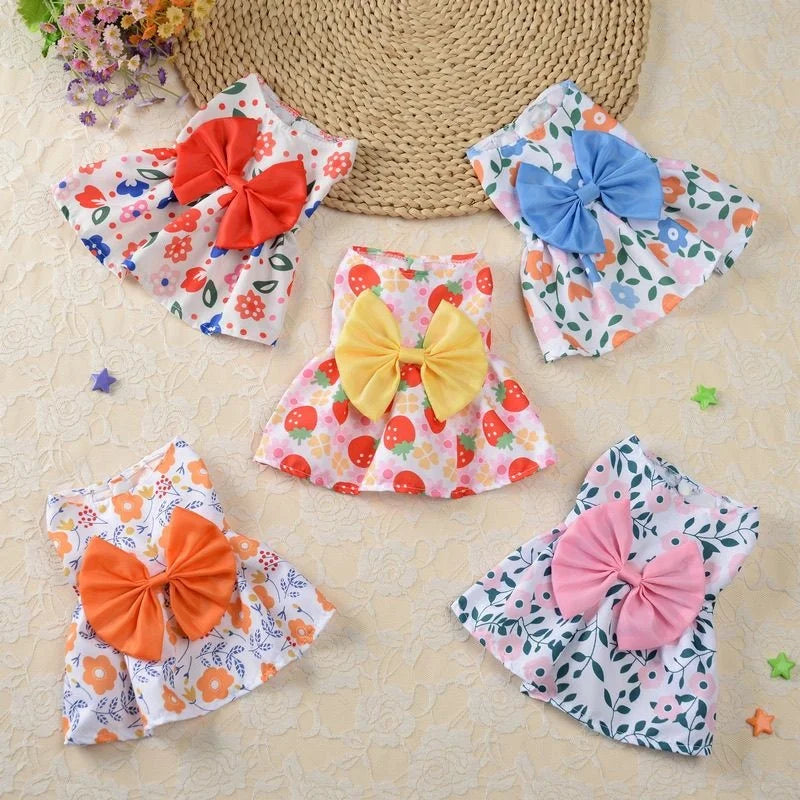 Cute floral princess dresses for small dogs and kittens with large bows, perfect for summer pet fashion.