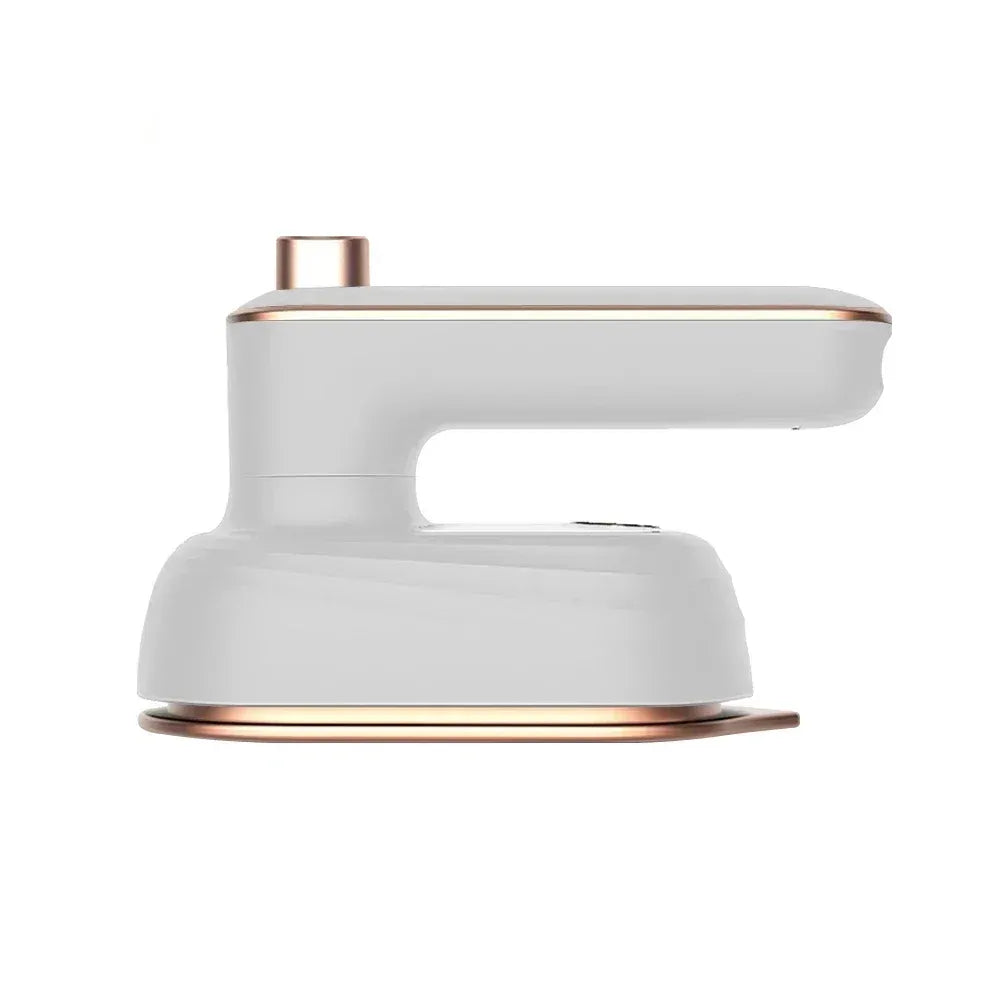 Portable handheld clothes steamer in white and rose gold for travel and garment care.