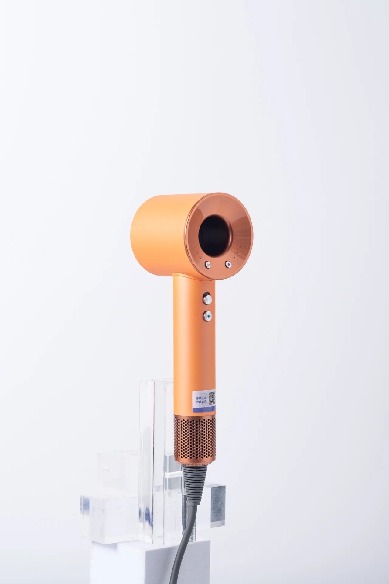 Orange high-speed negative ion bladeless hair dryer with magnetic attachments and ergonomic hollow design.