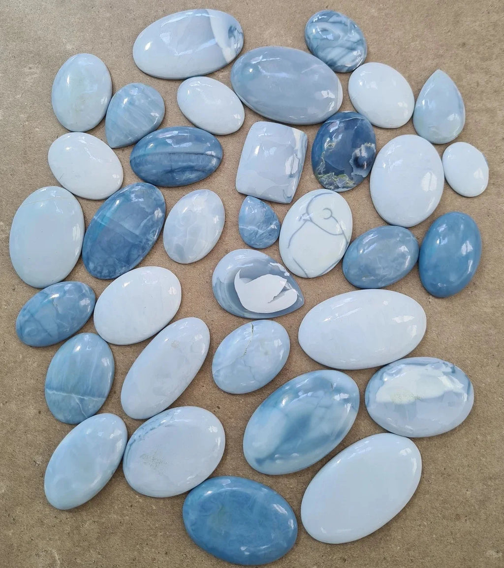 Natural blue opal cabochon gemstones, smooth ovals and rounded stones, mixed sizes