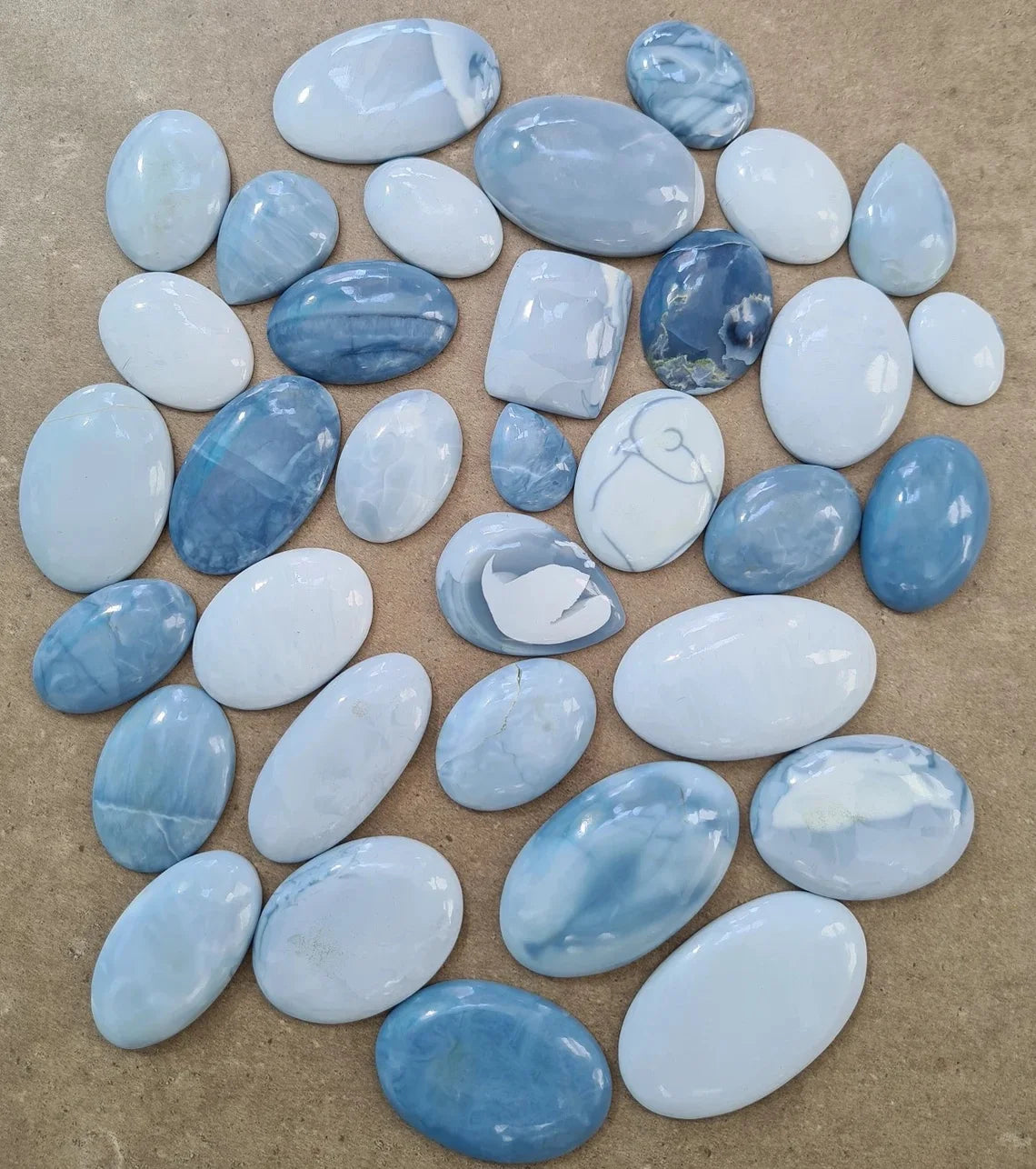 Natural blue opal cabochon gemstones, smooth ovals and rounded stones, mixed sizes