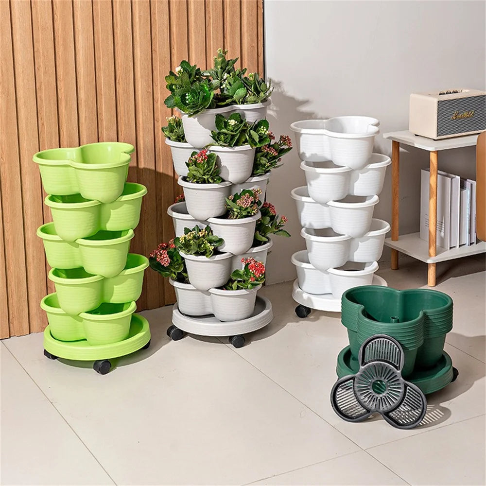 Vertical garden planter stand with wheels, green and white stacked pots arranged indoors.