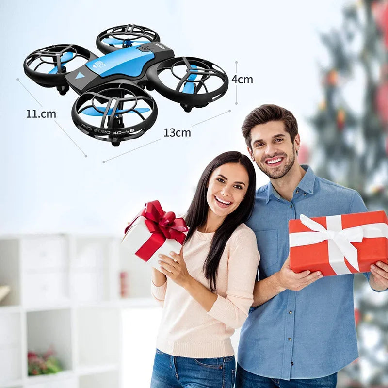Small blue and black drone, 13x11x4cm, with protective propeller cages for indoor flying.
