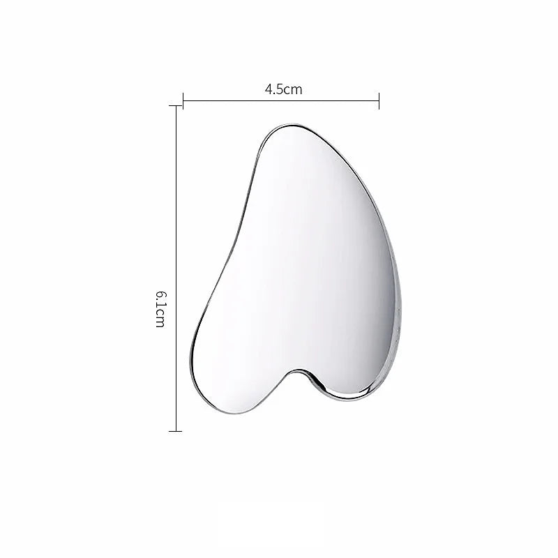 Heart-shaped, reflective silver Gua Sha facial massager. Dimensions labeled as 6.1cm high and 4.5cm wide.