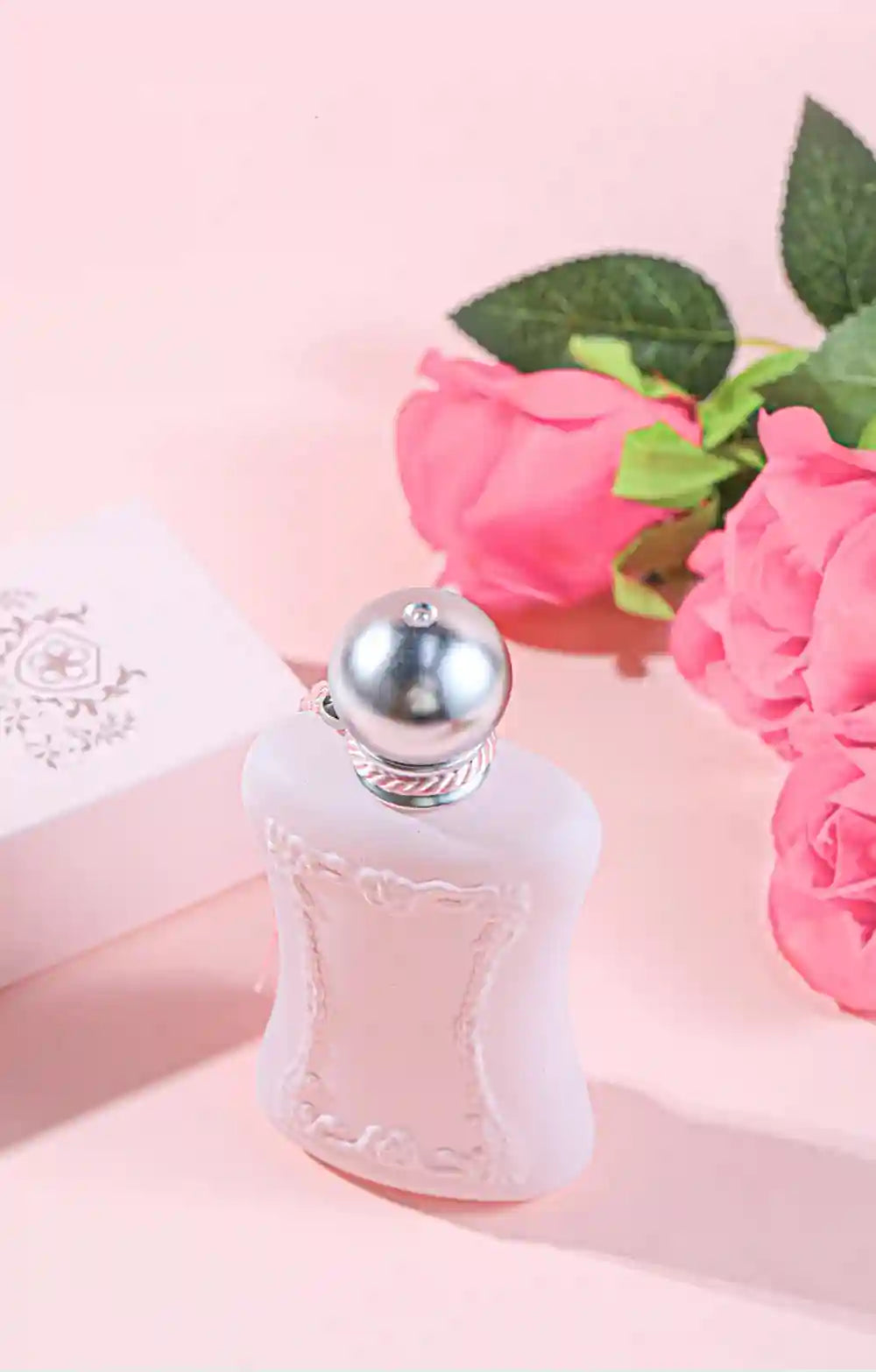 Luxury floral Eau de Parfum for women, 75ml pink matte bottle with silver cap, elegant feminine pheromone perfume.