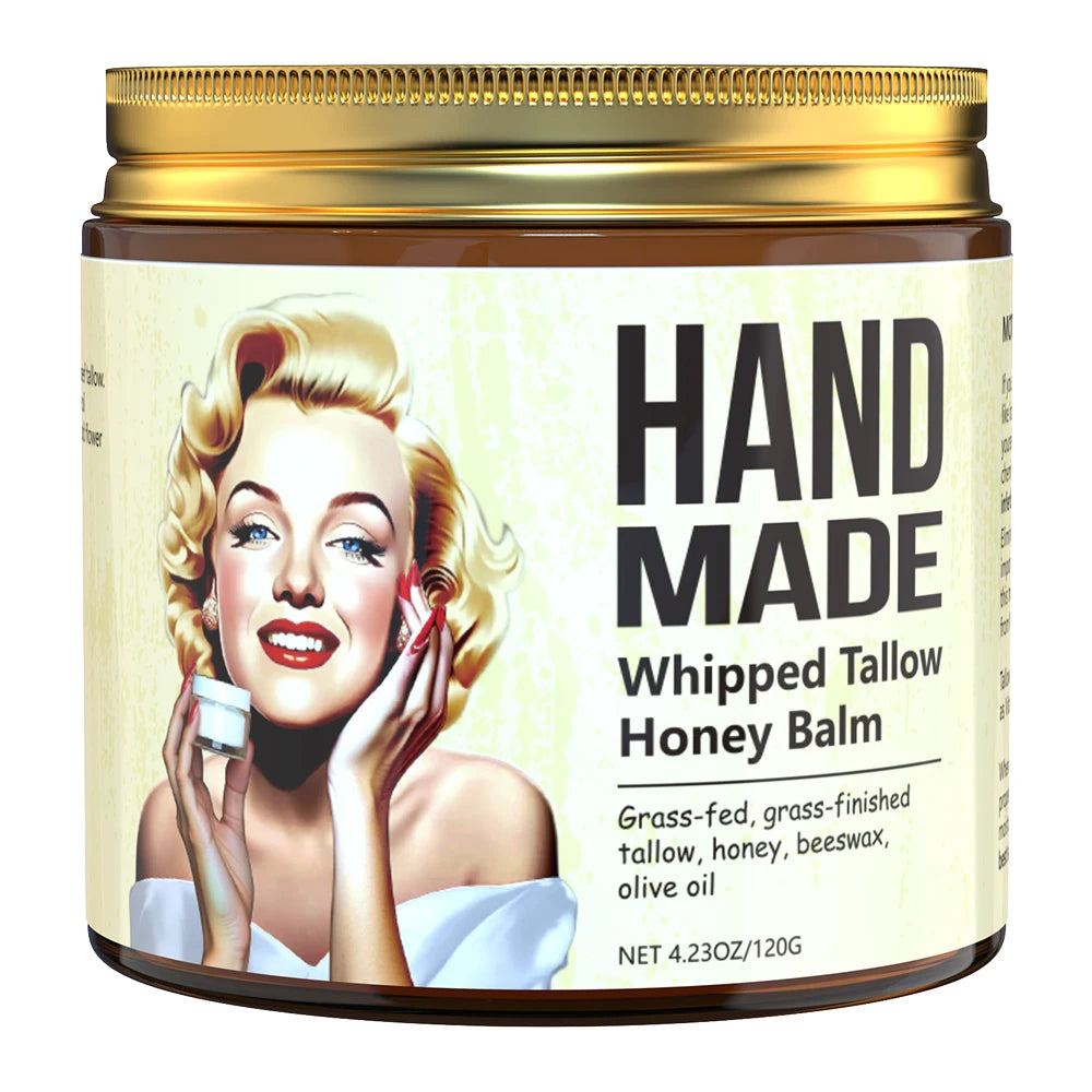 Glass jar of Hand Made Whipped Tallow Honey Balm with a gold lid and a retro-style illustration of a blonde woman.