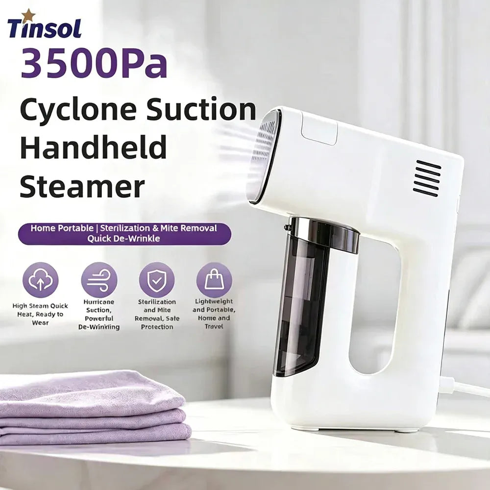 Tinsol handheld clothes steamer releasing steam next to folded purple fabric for quick de-wrinkling.