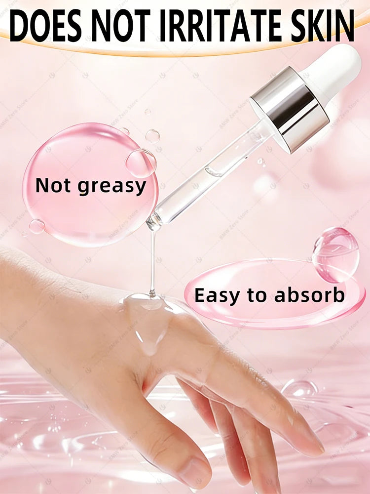 A glass dropper dispensing clear serum onto a person's hand against a soft pink background with water droplet bubbles.