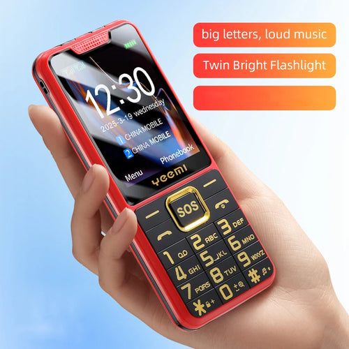 Red Yeemi senior phone held in hand, features large push-buttons, SOS key, dual SIM, and bright torch light.