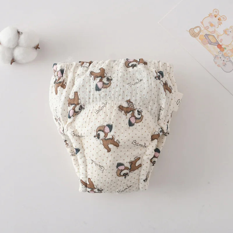Baby care reusable cloth diaper with Bambi fawn print and polka dots, soft cotton material.