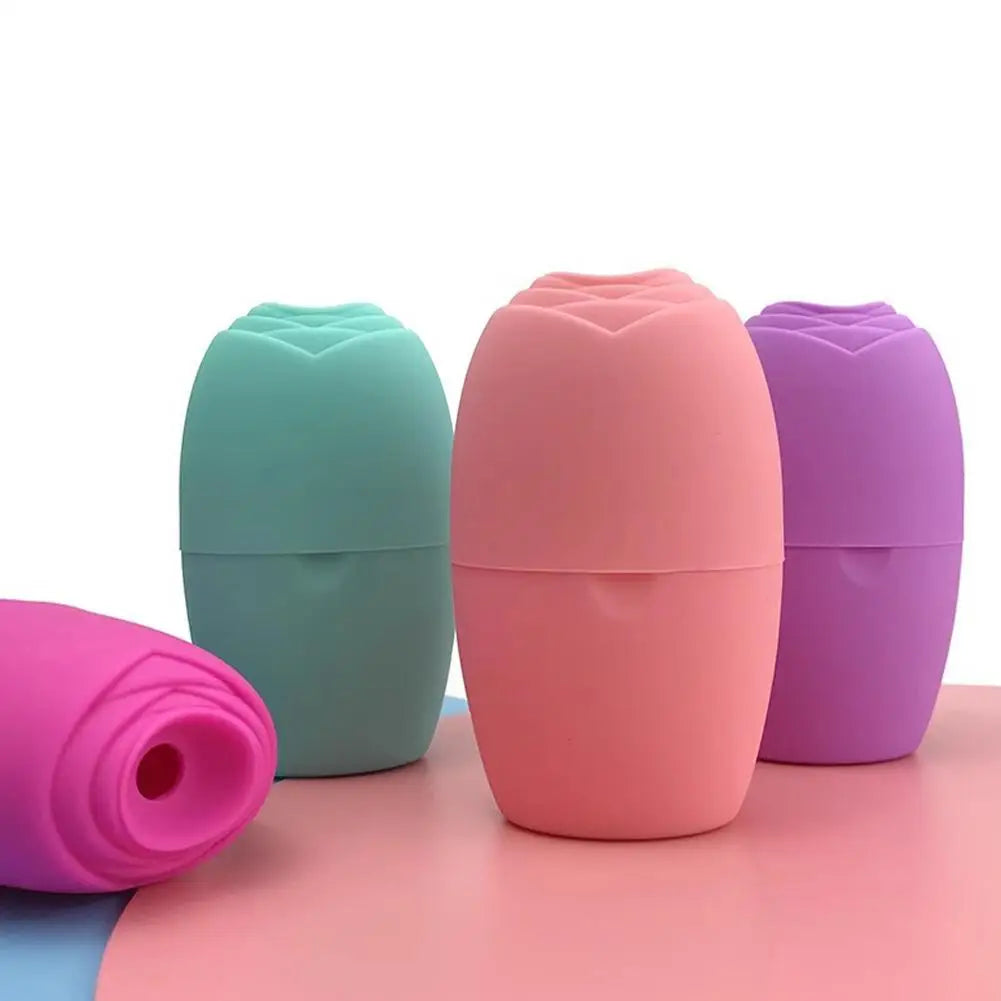Four rose-shaped silicone ice face rollers in pastel pink, teal, and purple stand on a surface.
