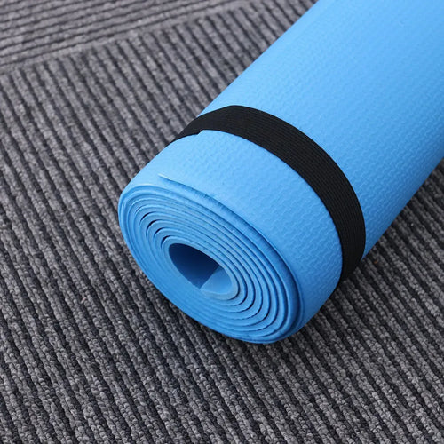 Anti-slip EVA yoga mat in blue, portable smart yoga mat for fitness and exercise, side angle view of rolled gear.