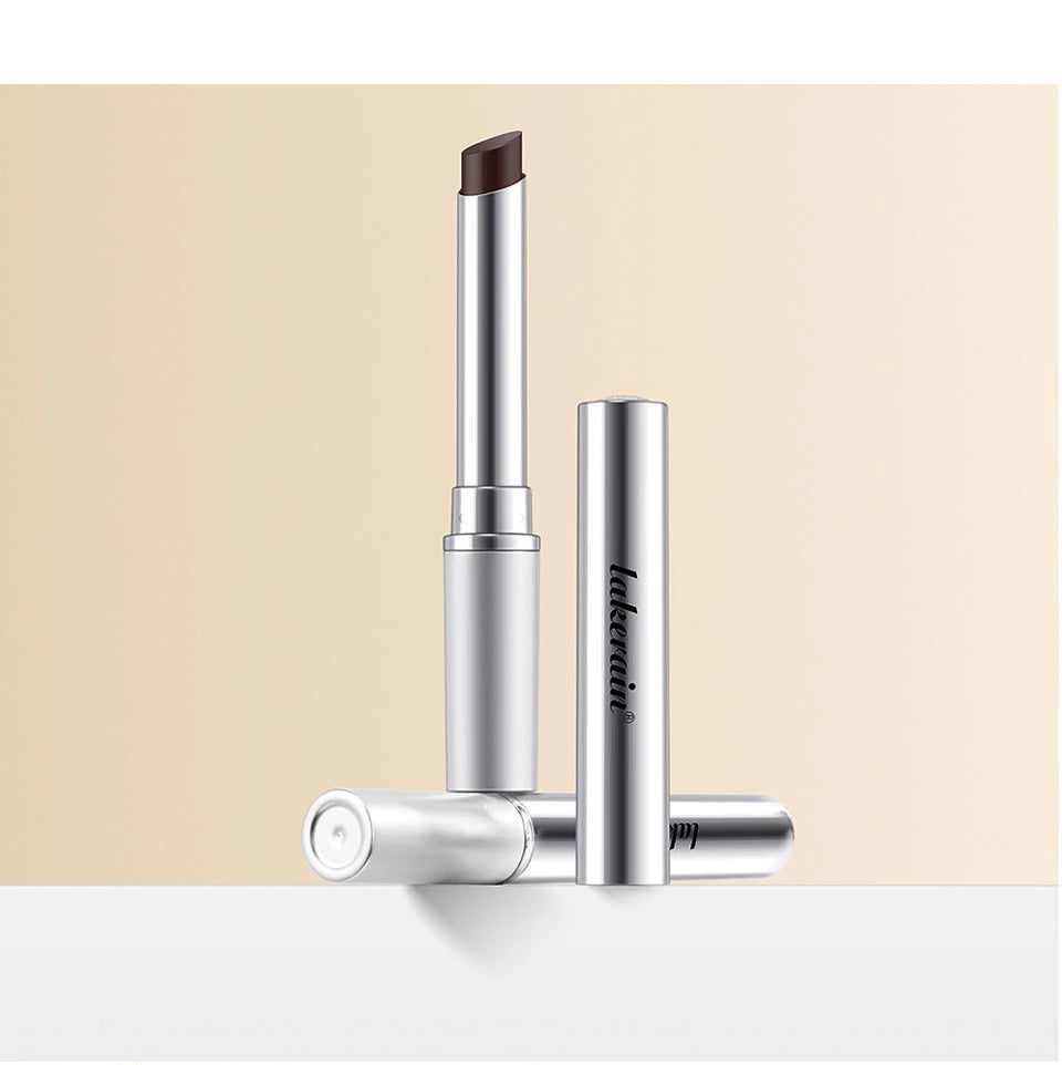 Nourishing black-brown honey lipstick in a sleek silver tube. Long-lasting, non-stick tinted lip balm for plump lips.