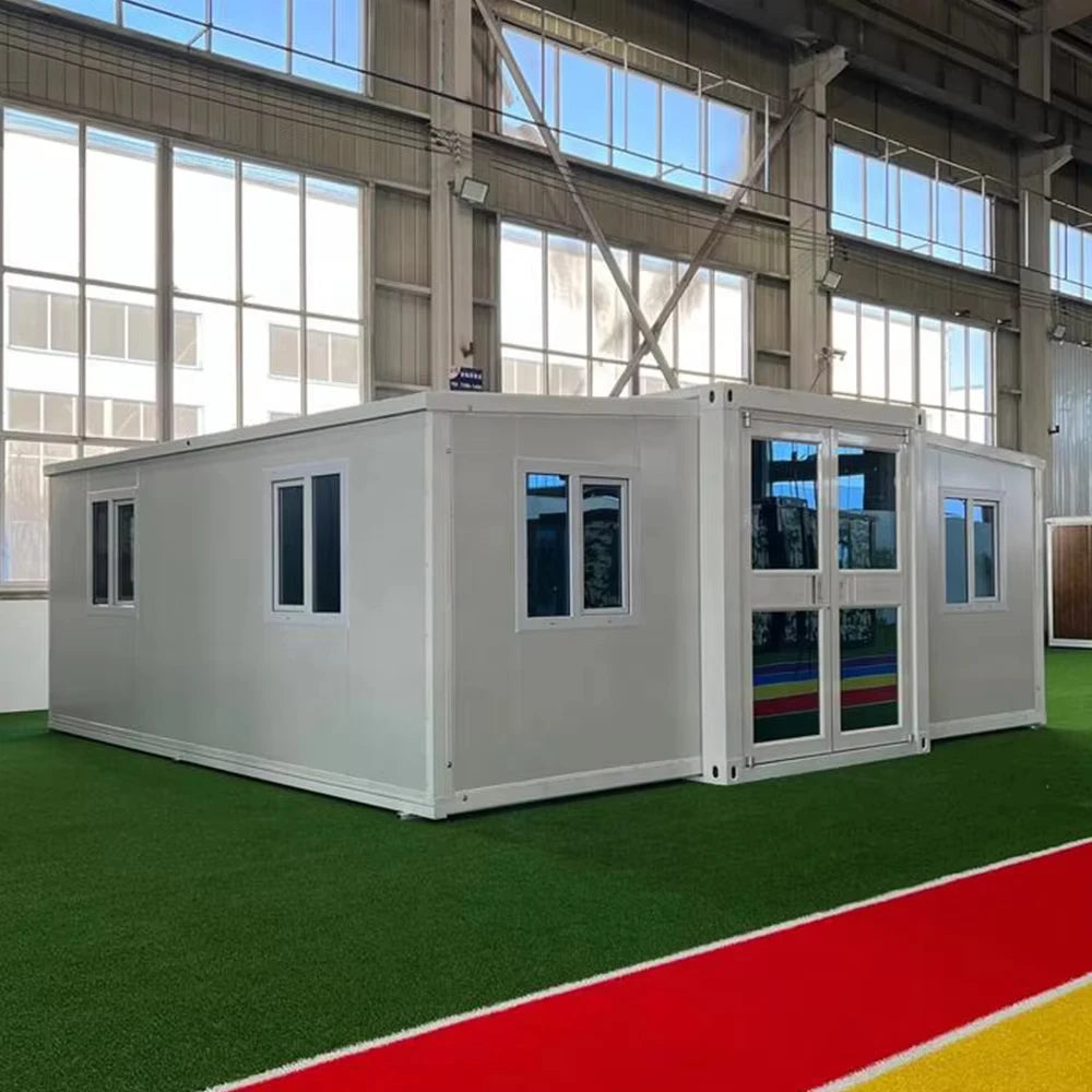 White modular container office with large glass windows and paneled exterior walls