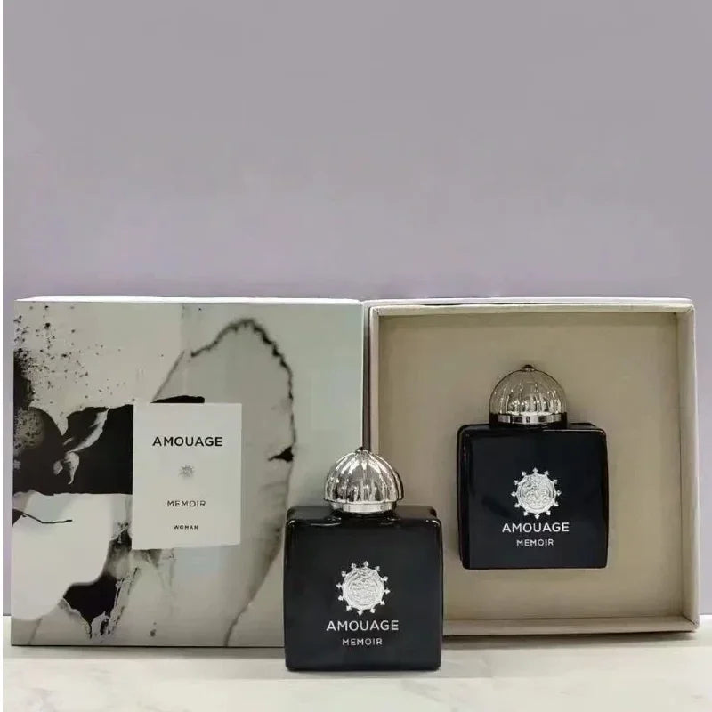 Amouage Memoir Woman EDP: Luxury black square bottles with silver domes, Arabian woody floral scent, 100ml gift set.