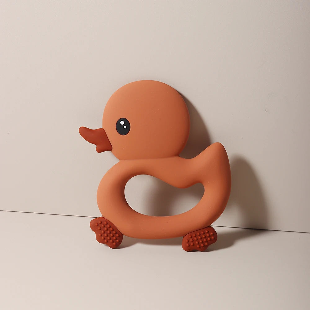 Rust orange duck silicone teething toy for baby teething relief.
