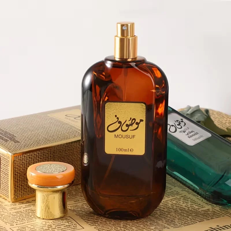 Mousuf Intense 100ml unisex EDP spray, sweet musk Arabian perfume in an amber glass bottle with gold cap and label.