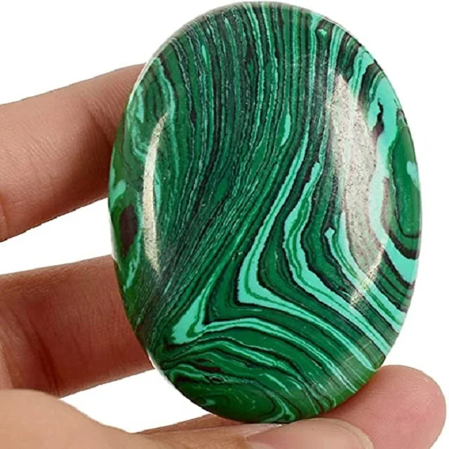 Oval green malachite palmstone with natural striped banding