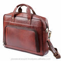 Brown genuine leather vintage business briefcase for 15.6-inch laptop with top handles and shoulder strap.