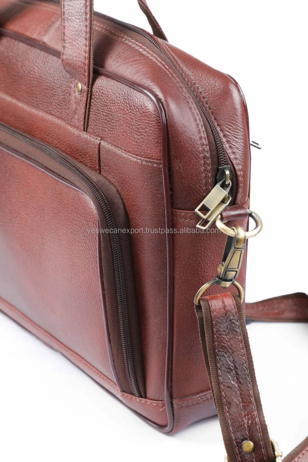 Brown genuine leather vintage business briefcase for 15.6-inch laptop with metal zippers, top handle, and strap.