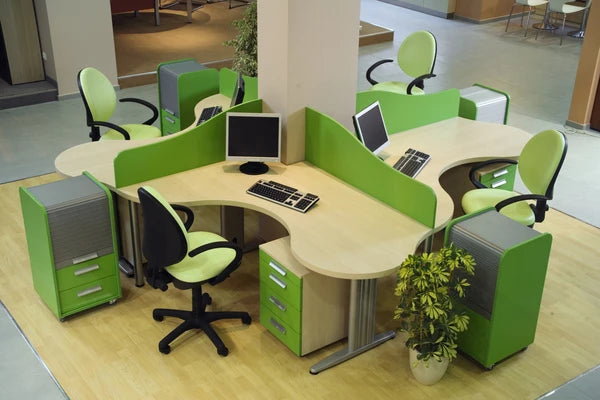Green and beige office workstation with chairs and shared table